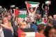 Delegates wave Palestinian flags at the Labour Party’s 201