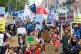 ANSWERS NEEDED: People take part in a climate protest in Dub