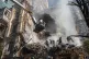 irefighters work after a drone attack on buildings in Kyiv, 