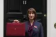 Chancellor of the Exchequer, Rachel Reeves, holds up the tra