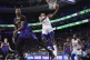 hiladelphia 76ers' Tyrese Maxey (0) goes up for a shot past 