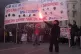 A student holds a flare as several thousand high school and 