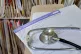 A registration form and a stethoscope at the Temple Fortune 